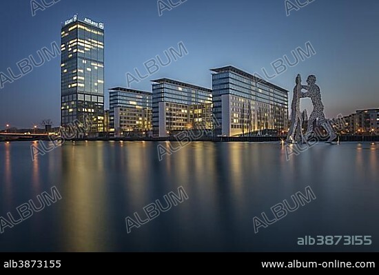Treptowers and Molecule Men monument in the river Spree during blue hour, Berlin-Treptow, Berlin, Germany, Europe.