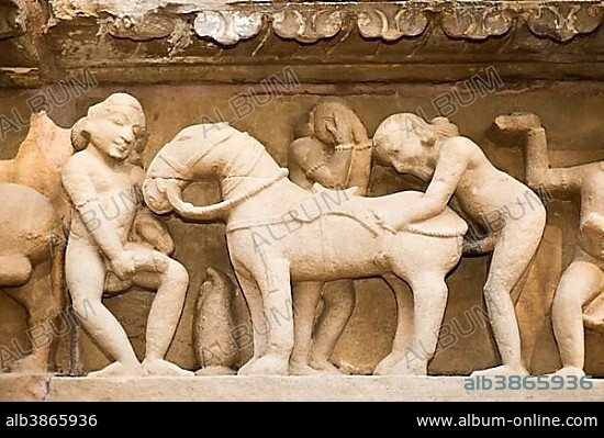 Relief on the outside the Lakshman Temple displaying a sodomist scene of men copulating with a horse, temple district of Khajuraho, Khajuraho Group of Monuments, UNESCO World Heritage Site, Khajuraho, Madhya Pradesh, India, Asia.