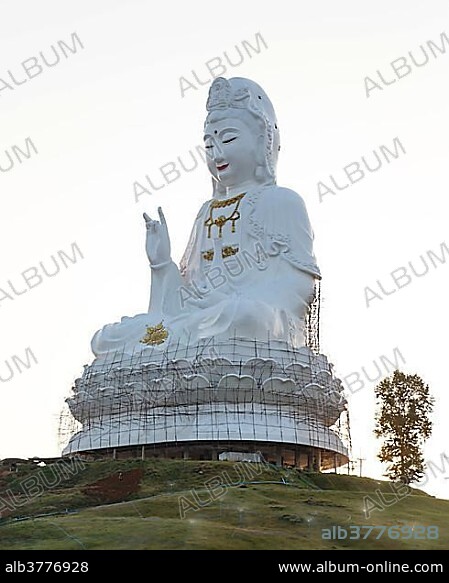 Huge Guan Yin or Kuan Yin statue at the Wat Huay Pla Kang temple, sitting Buddha on lotus flower, Chiang Rai Province, Thailand, Asia.