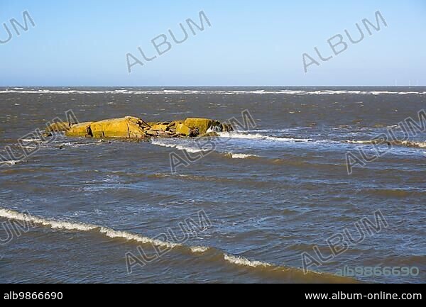 Remains of a World War II bunker on the island of Minsener Oog, Lower Saxony Wadden Sea National Park, Lower Saxony, Germany, Europe.
