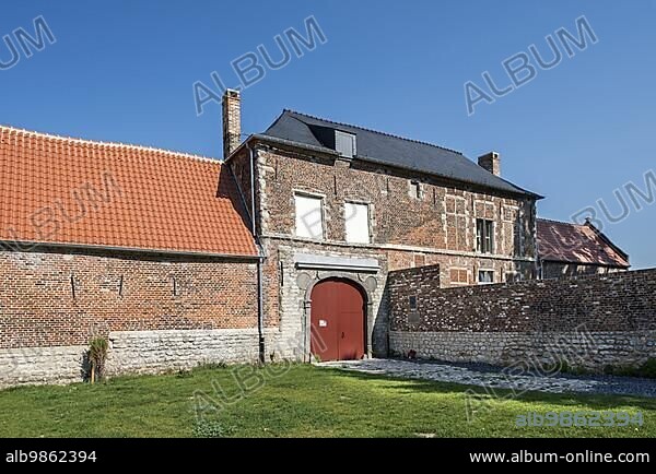 Entrance gate of the renovated Château d'Hougoumont, farmhouse where British and other allied forces faced Napoleon's Army at the Battle of Waterloo on June 18, 1815, Braine-l'Alleud, Belgium, Europe.
