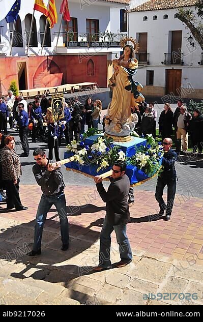 Men carrying a statue of the Virgin Mary, Semana Santa, Holy Week procession in La Nucia, Costa Blanca, Spain, Europe.