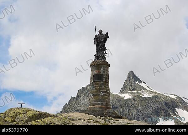Statue of Saint Bernard, Grand Saint-Bernard, Great St Bernard Pass, Col du Grand-Saint-Bernard, Colle del Gran San Bernardo, Pennine, Valais Alps, Italy, Europe.