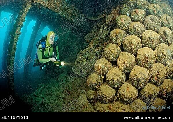 Diver in shipwreck Umbria, Bombs, Sudan, Africa, Red Sea, Wingate Reef, Africa.