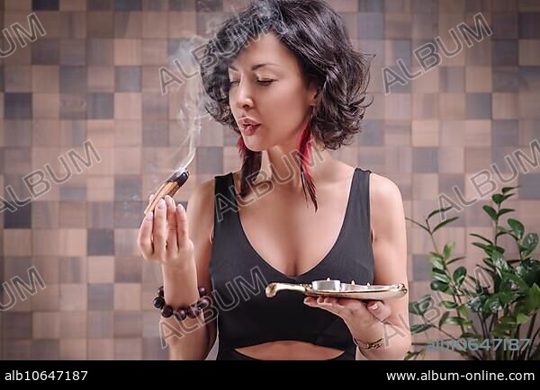 Image of an adult woman in yoga place. Meditation. Palo santo burns. The concept of yoga and spiritual practices. Mixed media.