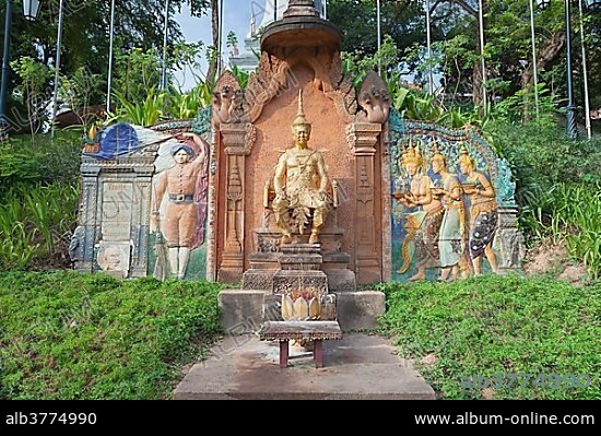 Bas-relief and statue at the Wat Phnom, Phnom Penh, Cambodia, Asia.