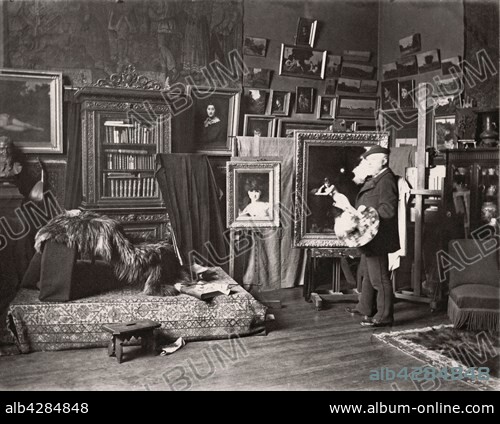 French painter Jean-Jacques Henner in his studio located 11 rue Pigalle in the 9th arrondissement in Paris.. On the easel, the artist is finishing 'Solitude', which is now located at the musée Jean-Jacques Henner in Paris.. c.1885. Albumen print. Jean-Jacques Henner (1829-1905).