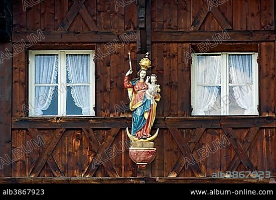 Madonna on an Upper Bavarian wooden house, alpine village Ammertal at Echelsbach, Upper Bavaria, Bavaria, Germany, Europe.