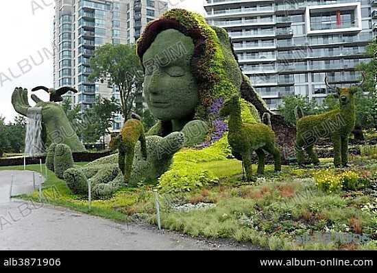 Plant sculpture Mother Earth with modern buildings behind, Mosaicanada Exhibition, Gatineau, Quebec Province, Canada, North America.