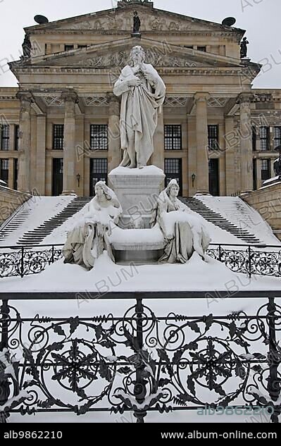 Schiller Monument by Reinhold Begas in front of the concert hall (formerly Schauspielhaus) at the Gendarmenmarkt in Berlin Mitte. The Gendarmenmarkt is a square in Berlin, and the site of the concert hall and the French and German Cathedrals. The centre of the Gendarmenmarkt is crowned by a statue of Germany's poet Friedrich Schiller.