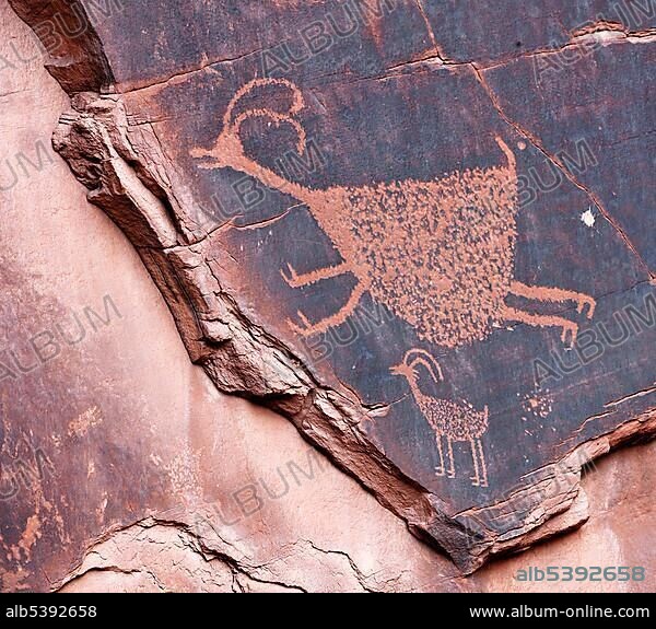 Petroglyphs etched in sandstone, symbols, prehistoric and historic rock art, wall drawings by the Anasazi Native Americans, Monument Valley, Navajo Tribal Park, Navajo Nation Reservation, Arizona, Utah, United States of America, USA, North America.