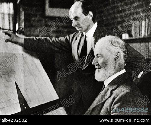 English mechanic Henry Royce at his drawing table, with his design manager, Bill Hardy.. c.1930.