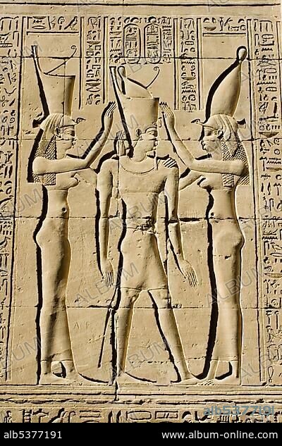 Coronation of King Ptolemy VIII conducted by the goddess Nechbet, right, and the goddess Uto or Wadjet, left, Temple of Horus, Edfu, Luxor, Nile Valley, Egypt, Africa.