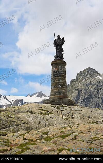 The statue of Saint Bernard, Grand Saint-Bernard, Great St Bernard Pass, Col du Grand-Saint-Bernard, Colle del Gran San Bernardo, Pennine, Valais Alps, Italy, Europe.