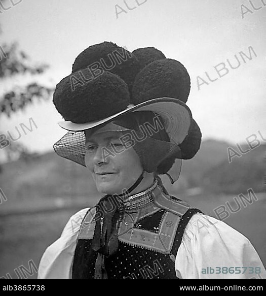 Woman in traditional traditional costume with hat, celebration, around 1950, surroundings of Freiburg, Germany, Europe.