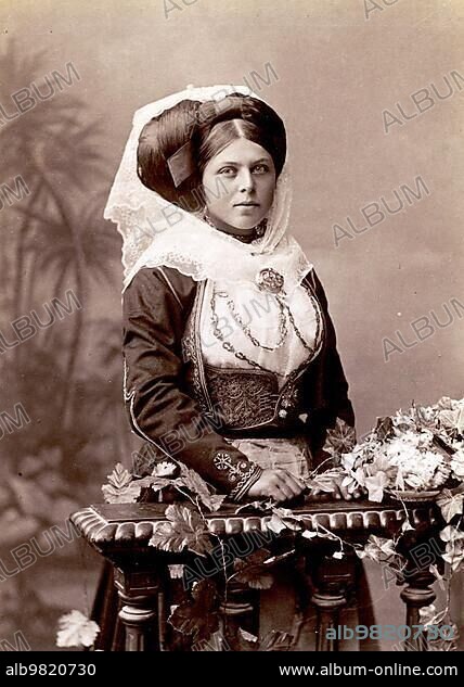 Studio portrait of a woman in traditional Greek dress; 1870; Greece; Historical; digitally restored reproduction from a 19th century original; Europe.
