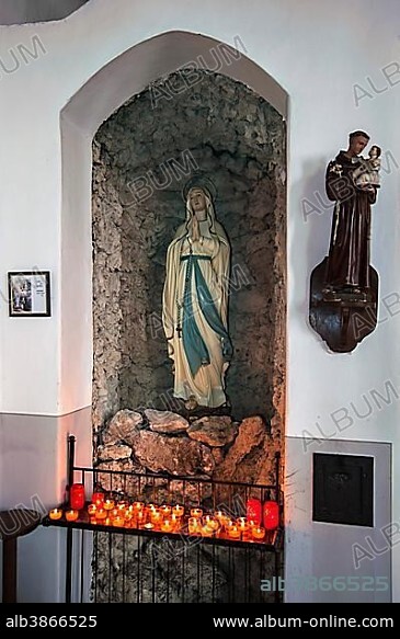 Virgin Mary with votive candles, Mühlfeldkirche church, Bad Tölz, Upper Bavaria, Bavaria, Germany, Europe.