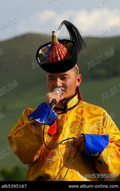 Singer wearing traditional Mongolian national costume during the Naadam Festival, Ulan Bator or Ulaanbaatar, Mongolia, Asia.