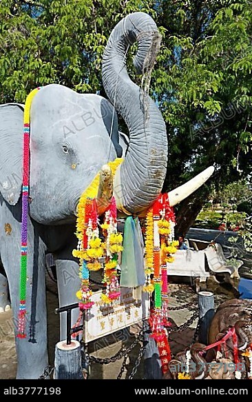 Statue of an elephant decorated with flowers, Wat Chalong temple, Phuket, Thailand, Asia.