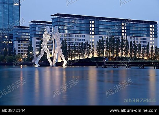 Molecule Man, artwork by American sculptor Jonathan Borofsky, and Treptowers building complex on the River Spree, Treptow, Berlin, Germany, Europe.