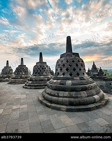 Temple complex Borobudur at sunrise, Stupas, cloudy sky, Borobudur, Yogyakarta, Java, Indonesia, Asia.