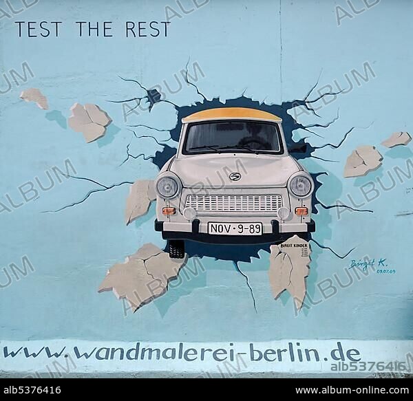 Birgit Kinder, Test the Rest, Trabant breaking through the Berlin Wall, by Birgit Kinder, painting on the Berlin Wall, East Side Gallery, Berlin, Germany, Europe.