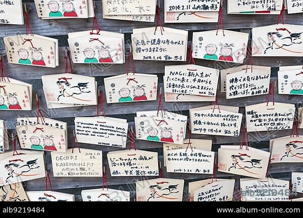 Japanese prayer plaques (boards), Ema, left by Buddhist worshippers, Hase-dera, Hase-kanno temple, Kamakura, Japan, Asia.