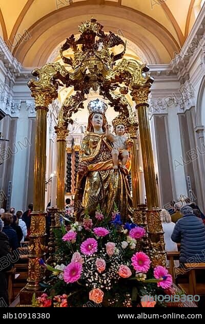 Madonna Santa Maria Statue and People Praying Inside the Church of San Nazzaro (Croglio) in Castelrotto, Ticino, Switzerland, Europe.