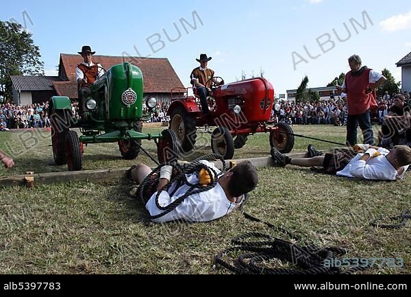 Discipline tractor dragging, Highland Games in Kreenheinstetten, Sigmaringen district, Upper Swabia, Baden-Wuerttemberg, Germany, Europe.