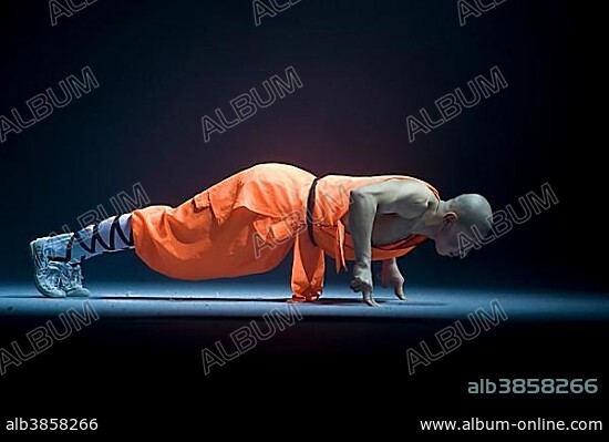 Pushup on two fingers, Shaolin monk during a show on the 22nd of March 2009 in Berlin, Germany, Europe.
