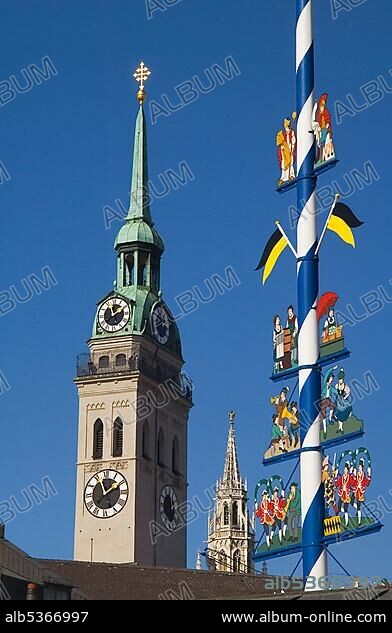 Maypole at the Viktualienmarkt and the Tower of the Saint PeterÂ´s Church, Munich, Bavaria, Germany, Europe.