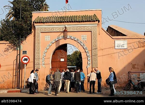 Tourists bouncing into the Palais de la Bahia, Medina, Marrakech, Morocco, Africa.