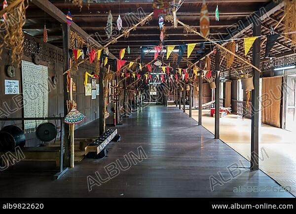 Traditional Iban longhouse with cultural-historical furnishings shows the way of life and history of the Iban tribe on the Santubong peninsula in the Malaysian state of Sarawak on Borneo.