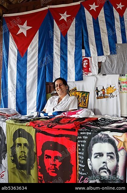 Cuban woman selling souvenirs, Cuban flag, T-shirts with portrait of Ernesto Che Guevara, Jardines de la Reina National Park, Archipelago, Camagüey and Ciego de Ávila Province, Caribbean, Cuba, Central America.