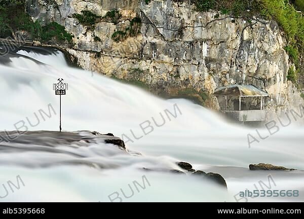 Rhine Falls at Schaffhausen with the historical marker of the low tides of the Rhine Falls in 1880 and 1963, Canton Schaffhausen, Switzerland, Europe.