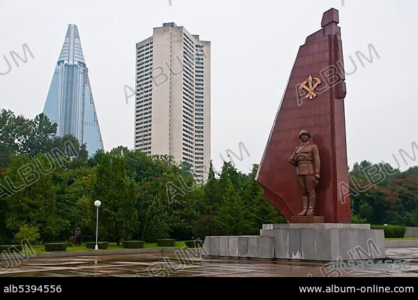 Monument to the Fatherland Liberation War, in front of the unfinished Ryugyong Hotel, the biggest hotel in Pyongyang, North Korea, Asia.