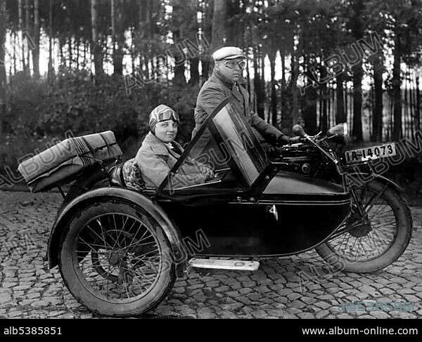 Couple riding a motorbike, woman sitting in a sidecar, around 1930, Germany, Europe.