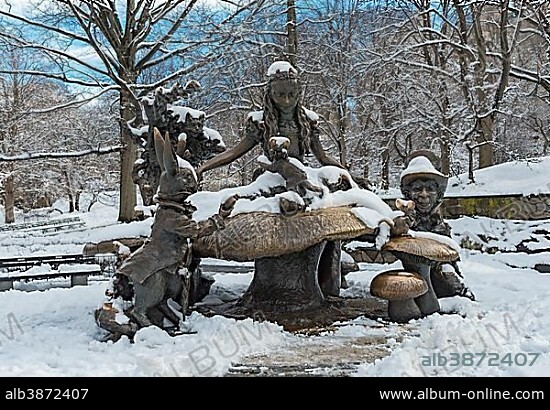 Alice in Wonderland Margaret Delacorte Memorial sculpture in Central Park in winter, New York City, USA, North America.