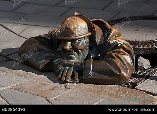 VIKTOR HULÍK. "Man at work", sculpture in a manhole cover, by Viktor Hulik, Bratislava, Slovakia, Europe.
