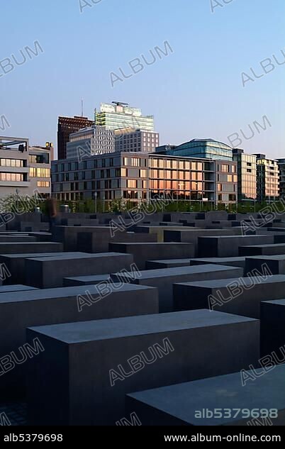 Holocaust Memorial designed by architect Peter Eisenman, memorial to the murdered jews of Europe, with a view of the skyline of the Potsdamer Platz square, Tiergarten district, Mitte district, Berlin, Germany, Europe.