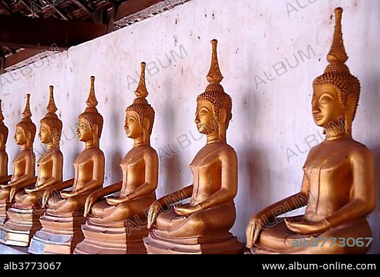 Theravada Buddhism, meditation, row of bronze Buddha statues, temple, That Ing Hang Stupa, in Savannakhet, Laos, Southeast Asia, Asia.