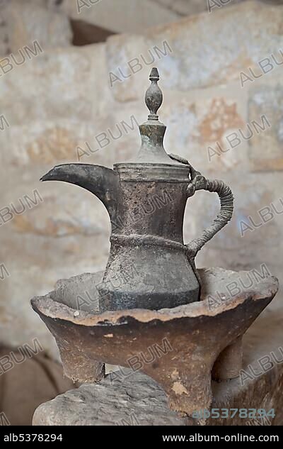 Bedouin clay hearth, mokadeh, and brass coffee pot, bakraj, from the Palestinian region, Museum for olive oil production, Bethlehem, West Bank, Palestine, Western Asia.