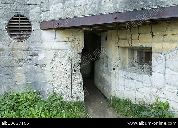 Impact of bullets on damaged casemate, artillery bunker of WWII Batterie d'Azeville Battery, part of German Atlantic Wall, Normandy, France, Europe.