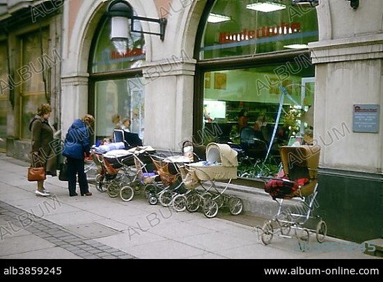 Kindertruhe children's store in Weimar, with strollers on display inside and outside, in April 1985, GDR, German Democratic Republic, Europe.