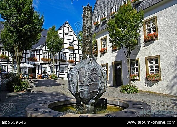 History fountain, in front of restaurant 'Ratsschänke', Old Town, Brilon, North Rhine-Westphalia, Germany, Europe.