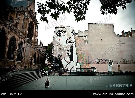 Graffiti near St. Merri Church in Le Marais, Paris, Ile de France, France, Europe.
