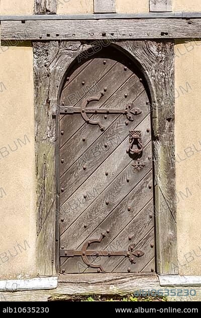 Old wooden door church of All Saints, Crowfield, Suffolk, England, UK.