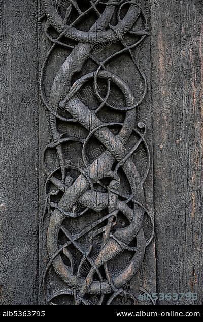 Artfully carved north portal, Celtic art with traditions of the Vikings, Urnes Stave Church, Romanesque church from ca. 1130, Vestland, Norway, Europe.