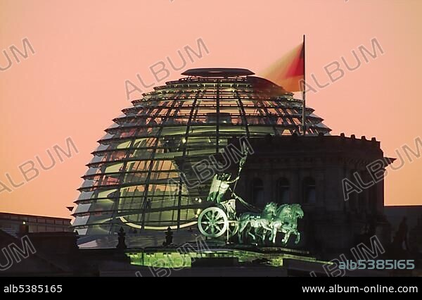 Dome of the Reichstag parliament and Quadriga of the Brandenburg Gate in the sunset, Berlin, Germany, Europe.