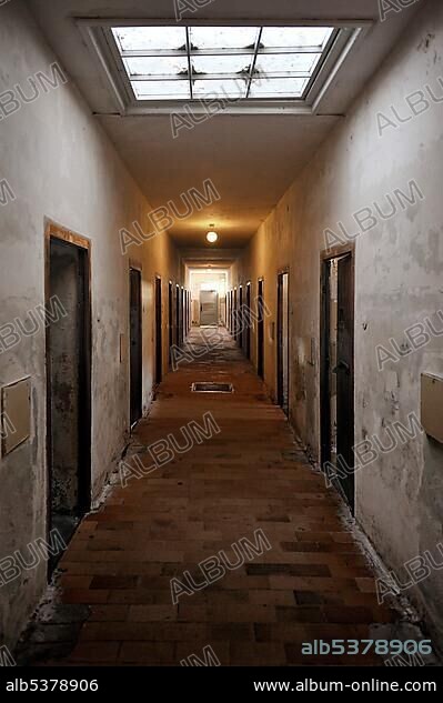 Corridor in a jail, bunker with celldoors, Dachau Concentration Camp, Dachau, near Munich, Bavaria, Germany, Europe.